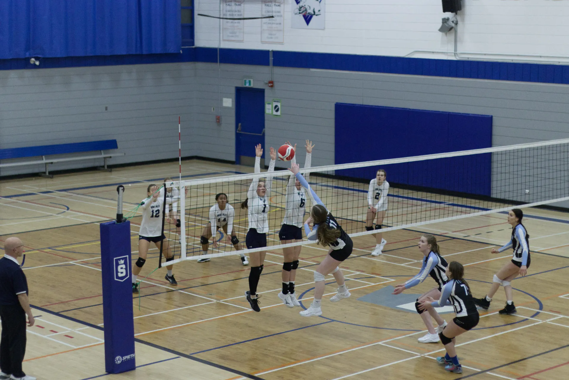 Vision VBC team celebrating with medals after tournament victory