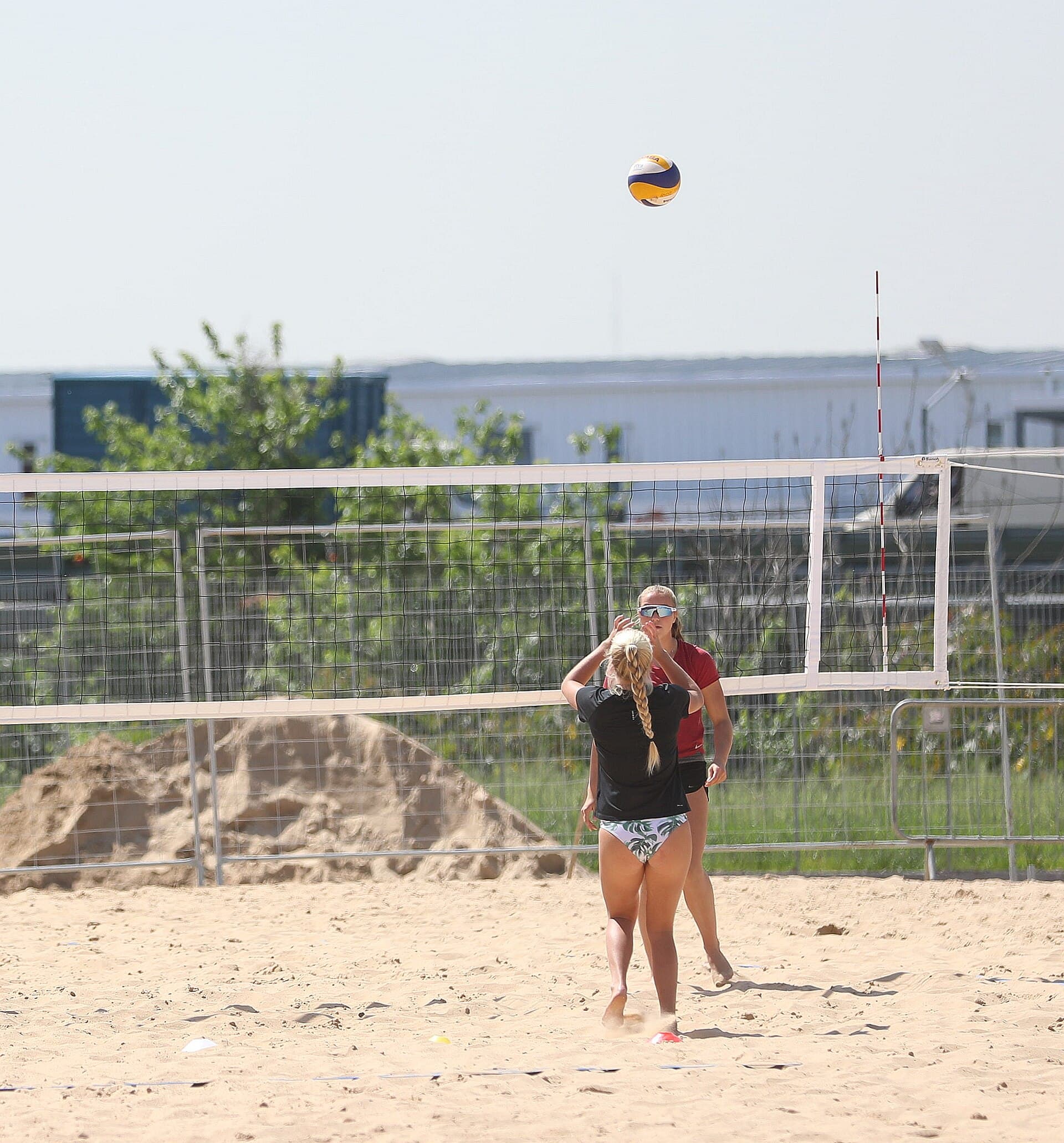 Coach working one-on-one with a volleyball athlete