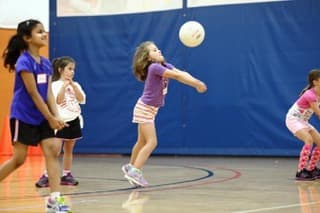 Young athletes participating in a Vision Elite school volleyball session