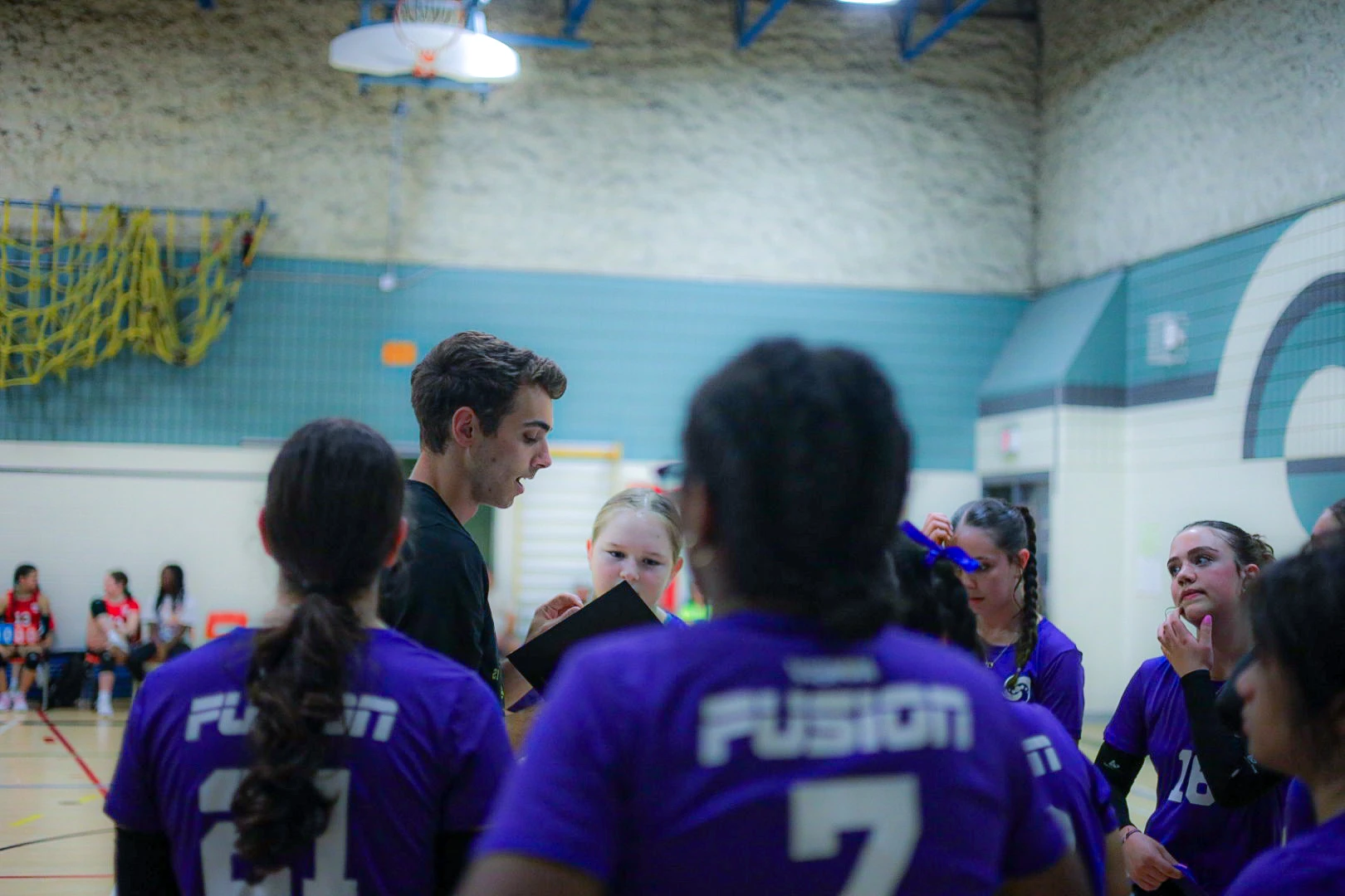 Coach organizing team lineup at Premier League