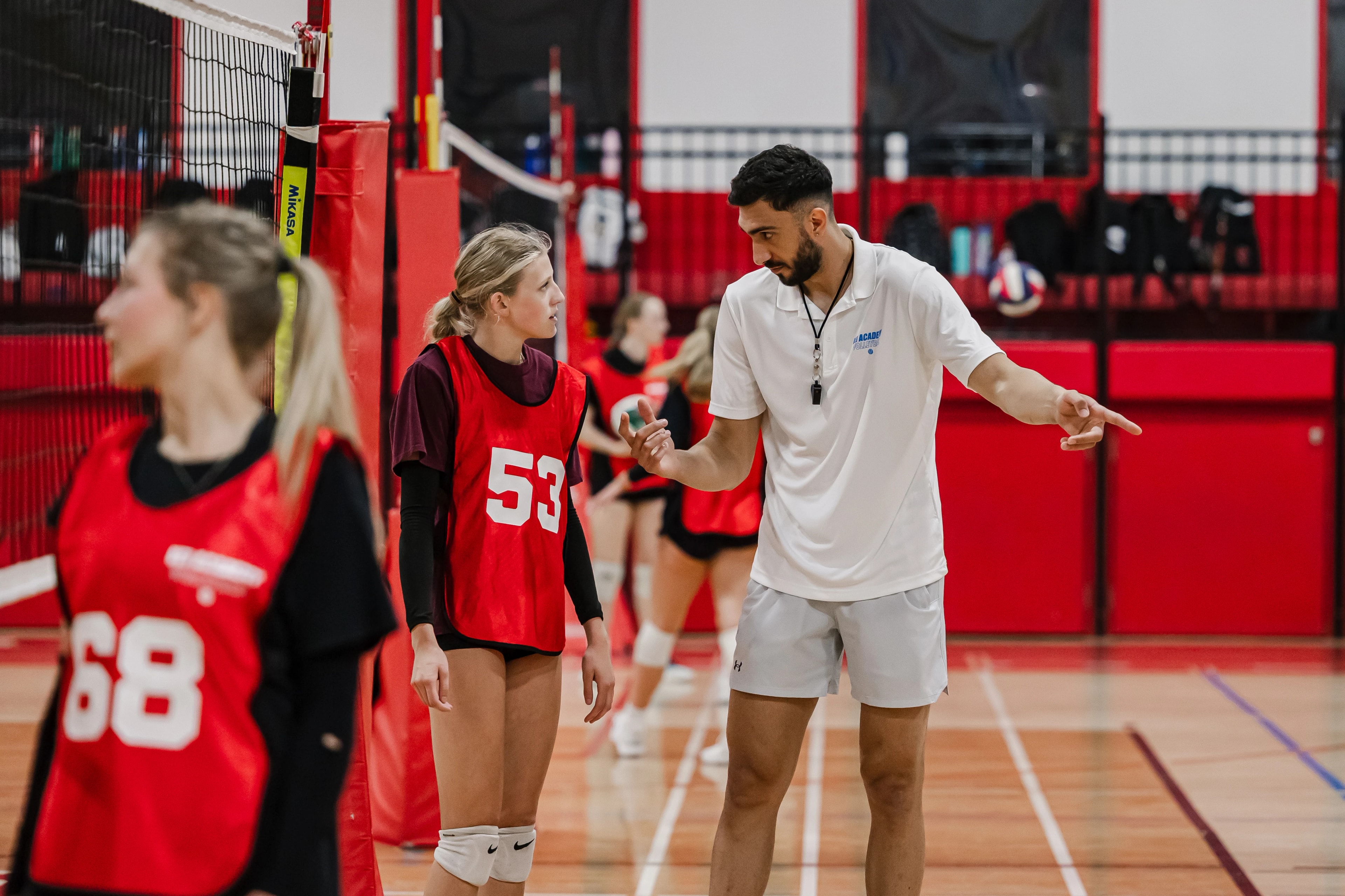 Coach providing instruction during VISION Elite assessment camp