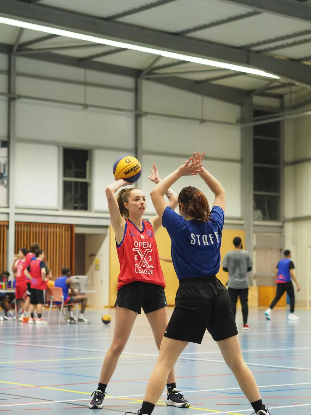 Girls playing basketball together during a game
