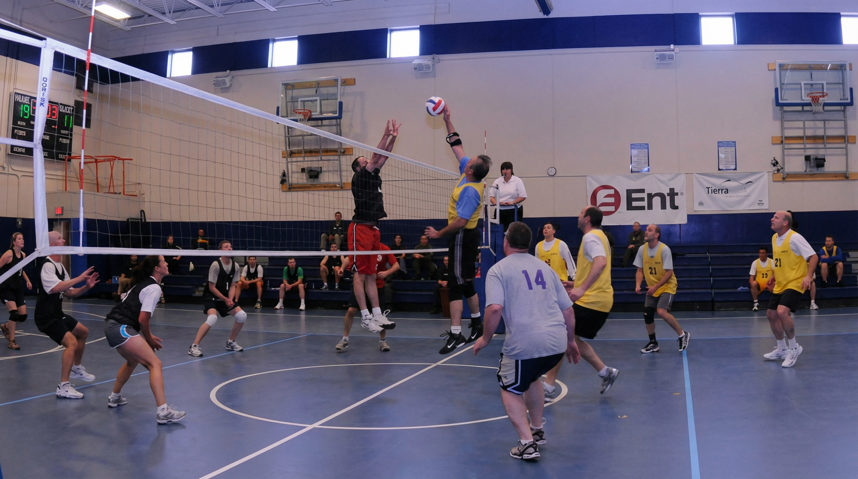 Adult co-ed volleyball match at a Vision Elite Academy event